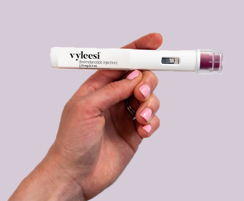 Woman holding a Vyleesi injector